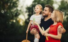 Family blowing bubbles